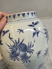 A Chinese blue and white vase with floral design and wooden cover, Transitional period