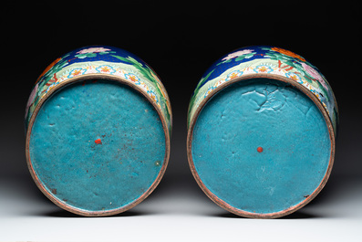 A pair of large Chinese cloisonn&eacute; vases with birds among flowering branches, 20th C.
