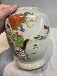A Chinese famille rose 'warrior on horseback' vase and a wooden cover, Yongzheng/Qianlong