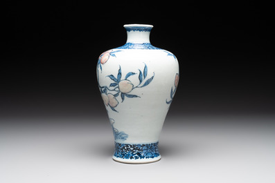 A Chinese blue, white and copper-red 'meiping' vase with 17 peaches, Yongzheng mark, 19/20th C.