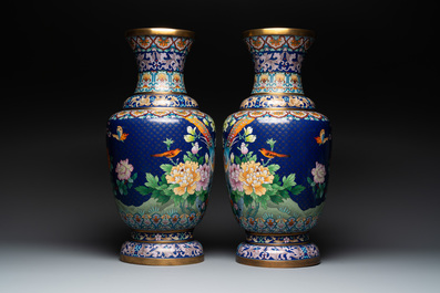 A pair of large Chinese cloisonn&eacute; vases with birds among flowering branches, 20th C.