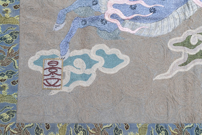 A Japanese embroidered wool and silk wall tapestry with a dragon and qilin, Meiji, 19th C.