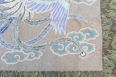 A Japanese embroidered wool and silk wall tapestry with two phoenixes, Meiji, 19th C.