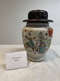A Chinese famille rose 'warrior on horseback' vase and a wooden cover, Yongzheng/Qianlong