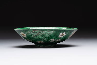 A Chinese verte biscuit 'animals among waves' bowl and a wooden stand, Jiajing mark, Kangxi