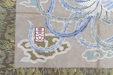 A Japanese embroidered wool and silk wall tapestry with two phoenixes, Meiji, 19th C.