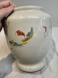 A Chinese famille rose 'warrior on horseback' vase and a wooden cover, Yongzheng/Qianlong