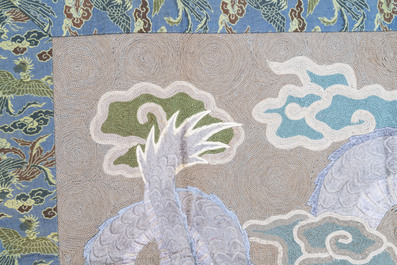 A Japanese embroidered wool and silk wall tapestry with a dragon and qilin, Meiji, 19th C.