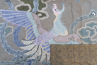 A Japanese embroidered wool and silk wall tapestry with two phoenixes, Meiji, 19th C.