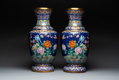 A pair of large Chinese cloisonn&eacute; vases with birds among flowering branches, 20th C.