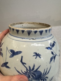 A Chinese blue and white vase with floral design and wooden cover, Transitional period