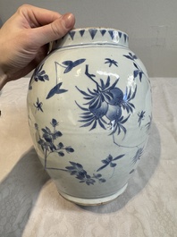 A Chinese blue and white vase with floral design and wooden cover, Transitional period