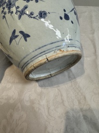 A Chinese blue and white vase with floral design and wooden cover, Transitional period
