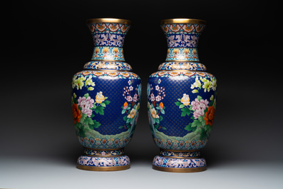A pair of large Chinese cloisonn&eacute; vases with birds among flowering branches, 20th C.