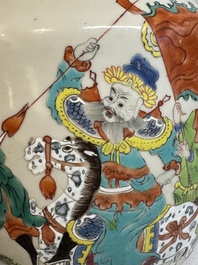 A Chinese famille rose 'warrior on horseback' vase and a wooden cover, Yongzheng/Qianlong
