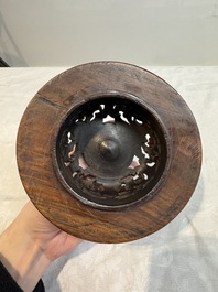 A Chinese blue and white vase with floral design and wooden cover, Transitional period