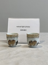A pair of rare Chinese gilt-decorated grisaille and iron-red miniature 'horse' cups, Yongzheng/Qianlong