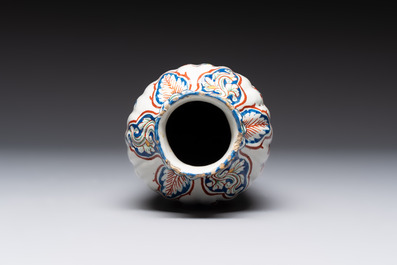 A fine polychrome Dutch Delft cashmere palette ribbed vase with birds among flowering branches, early 18th C.
