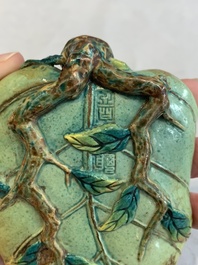 Two Chinese famille rose 'erotic' snuff bottles and a leaf-shaped saucer, 19th C.