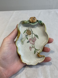 Two Chinese famille rose 'erotic' snuff bottles and a leaf-shaped saucer, 19th C.