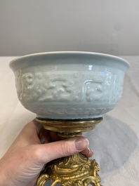 A Chinese white-glazed 'anhua' 'chilong' bowl on gilt bronze stand, 18/19th C.