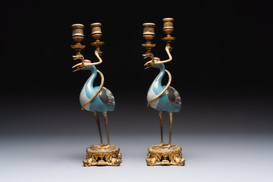 A pair of Chinese cloisonn&eacute; cranes, later mounted as candelabras, 18th C.