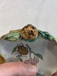Two Chinese famille rose 'erotic' snuff bottles and a leaf-shaped saucer, 19th C.