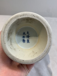 A Chinese blue and white 'mountainous landscape' vase, Yongzheng mark and of the period