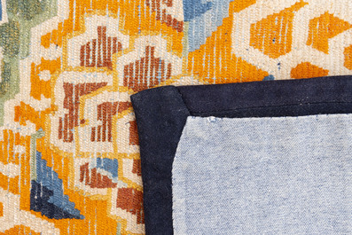 Two Tibetan saddle rugs and three small rugs, 19th C.