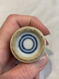 A Chinese famille rose seal paste box and a covered jarlet, a miniature wucai vase and a blue and white snuff bottle, Kangxi mark, 19/20th C.