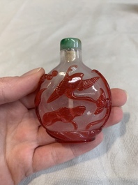 Three Chinese porcelain snuff bottles and a red Peking glass snuff bottle, Daoguang and Tongzhi mark, 19th C.