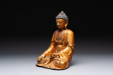 A Chinese gilt-lacquered wooden sculpture of Buddha, Ming