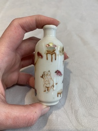 Two Chinese famille rose 'erotic' snuff bottles and a leaf-shaped saucer, 19th C.
