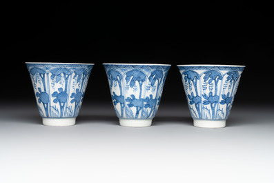 11 Japanese blue and white cups and 12 saucers with floral design, Chenghua mark, Meiji, 19th C.