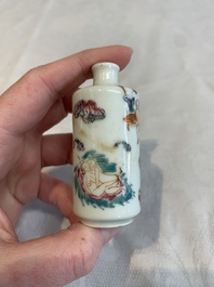 Two Chinese famille rose 'erotic' snuff bottles and a leaf-shaped saucer, 19th C.