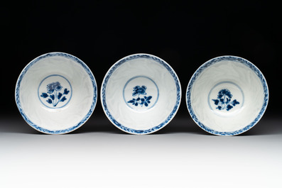 18 Chinese blue and white cups and 16 saucers with floral design, jade mark, Kangxi