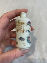 Two Chinese famille rose 'erotic' snuff bottles and a leaf-shaped saucer, 19th C.