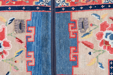 Two Tibetan saddle rugs with floral design, 19th C.