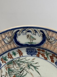 A Japanese Imari 'Parasol Ladies' dish after Cornelis Pronk, Edo, 18th C.