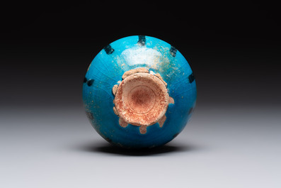A fine Raqqa turquoise-glazed striped jar, Syria, 13th C.