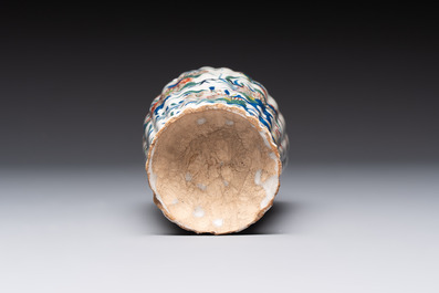 A fine polychrome Dutch Delft cashmere palette ribbed vase with birds among flowering branches, early 18th C.