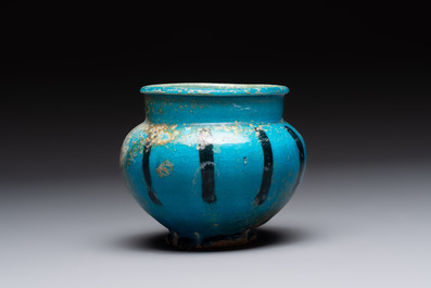 A fine Raqqa turquoise-glazed striped jar, Syria, 13th C.