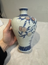 A Chinese blue, white and copper-red 'meiping' vase with 17 peaches, Yongzheng mark, 19/20th C.
