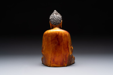 A Chinese gilt-lacquered wooden sculpture of Buddha, Ming