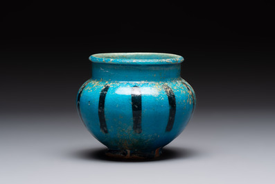 A fine Raqqa turquoise-glazed striped jar, Syria, 13th C.