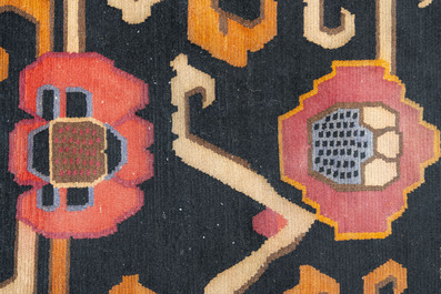 Two Tibetan woollen rugs with floral design, 19th C.