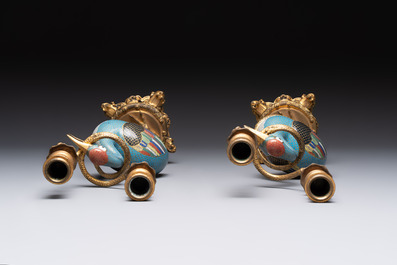 A pair of Chinese cloisonn&eacute; cranes, later mounted as candelabras, 18th C.
