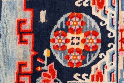 Two Tibetan saddle rugs and three small rugs, 19th C.