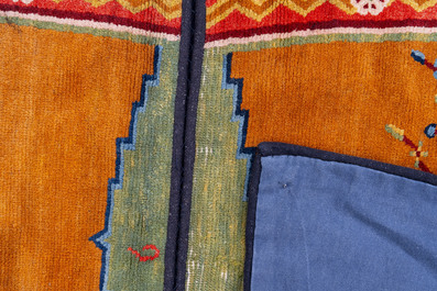 Two Tibetan saddle rugs with Buddhist lions and antiquities, 19th C.