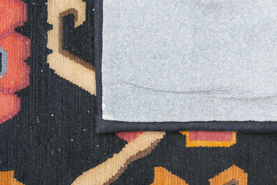 Two Tibetan woollen rugs with floral design, 19th C.